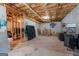 Unfinished basement with exposed ceiling, storage space and concrete floor at 372 River Point Dr, Mcdonough, GA 30252