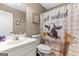 Whimsical bathroom with a quirky shower curtain and a modern vanity at 372 River Point Dr, Mcdonough, GA 30252