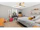 This bedroom features carpeted floors, a ceiling fan, and a make up vanity at 372 River Point Dr, Mcdonough, GA 30252