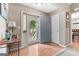 Welcoming foyer with wood floors, neutral walls, and a view to the front porch at 372 River Point Dr, Mcdonough, GA 30252