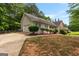 View of the side of the home featuring a driveway and an attached garage at 372 River Point Dr, Mcdonough, GA 30252