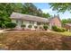 Charming ranch-style home with well-manicured landscaping and a welcoming front porch at 372 River Point Dr, Mcdonough, GA 30252