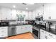 Updated kitchen featuring white cabinets, subway tile backsplash, and stainless steel appliances at 372 River Point Dr, Mcdonough, GA 30252