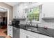 Bright kitchen featuring modern stainless steel appliances and subway tile backsplash at 372 River Point Dr, Mcdonough, GA 30252