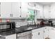 Bright kitchen featuring modern stainless steel appliances and subway tile backsplash at 372 River Point Dr, Mcdonough, GA 30252