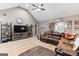 Comfortable living room featuring a vaulted ceiling, large TV, and cozy seating for a relaxing atmosphere at 372 River Point Dr, Mcdonough, GA 30252