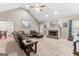 Spacious living room featuring a vaulted ceiling, brick fireplace, and comfortable seating, perfect for relaxation at 372 River Point Dr, Mcdonough, GA 30252