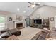 Cozy living room with a brick fireplace, plush carpet, and ample seating makes this room great for entertaining at 372 River Point Dr, Mcdonough, GA 30252