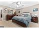 Comfortable bedroom with ceiling fan, natural lighting and carpeted floors create a cozy retreat at 372 River Point Dr, Mcdonough, GA 30252