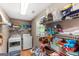Walk-in pantry with washer/dryer hookups, storage shelving, and natural light at 372 River Point Dr, Mcdonough, GA 30252