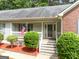 Charming porch with an American flag and 'Welcome' sign create an inviting entrance to this delightful home at 372 River Point Dr, Mcdonough, GA 30252