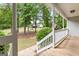 Inviting porch view showcases the lush greenery and serene surroundings of this charming home at 372 River Point Dr, Mcdonough, GA 30252