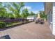 Spacious wooden deck with dining set, umbrella, and view of the backyard at 5327 David Se Cir, Covington, GA 30014