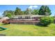 Backyard features a large deck perfect for outdoor dining and entertaining with shade trees at 5327 David Se Cir, Covington, GA 30014