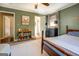 Cozy bedroom featuring plush carpet, ceiling fan, and an ensuite bathroom at 5327 David Se Cir, Covington, GA 30014