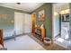 Cozy bedroom featuring plush carpet, ceiling fan, and an ensuite bathroom at 5327 David Se Cir, Covington, GA 30014
