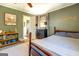 Cozy bedroom featuring plush carpet, ceiling fan, and an ensuite bathroom at 5327 David Se Cir, Covington, GA 30014