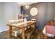 Dining room with hardwood floors, stylish wall accents, and wooden table set at 5327 David Se Cir, Covington, GA 30014