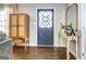 Elegant entryway with hardwood floors, decorative mirror, and stylish furnishings at 5327 David Se Cir, Covington, GA 30014