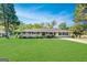 Well-manicured lawn and landscaping enhance this attractive single-story brick home at 5327 David Se Cir, Covington, GA 30014