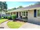 Inviting front porch with neutral chairs, walkway, and attractive landscaping create a welcoming entrance at 5327 David Se Cir, Covington, GA 30014