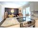 Kitchen with stainless steel stove and granite countertops overlooking dining room at 5327 David Se Cir, Covington, GA 30014