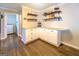 Kitchen view featuring granite countertops, white cabinets, and hardwood floors at 5327 David Se Cir, Covington, GA 30014