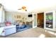 Bright living room with play area and view through sliding glass doors to dining room at 5327 David Se Cir, Covington, GA 30014