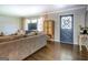 Cozy living room with hardwood floors, neutral decor, and a large window offering natural light at 5327 David Se Cir, Covington, GA 30014