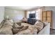 Comfortable living room with plush sectional, neutral tones, and ample space for relaxation at 5327 David Se Cir, Covington, GA 30014