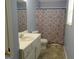 Cozy bathroom featuring a shower-tub combo and a single sink vanity with neutral tones at 56-1 N East Main St, Hampton, GA 30228