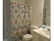 Bathroom with modern vanity and shower featuring a colorful shower curtain at 56-1 N East Main St, Hampton, GA 30228