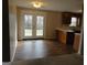 The kitchen has a dining area featuring a sliding door to the outside at 56-1 N East Main St, Hampton, GA 30228
