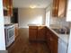 The kitchen features wood cabinets, white countertops, and an adjacent dining area at 56-1 N East Main St, Hampton, GA 30228