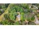 Aerial view of the property surrounded by lush greenery and mature trees providing privacy at 632 Cloudland Dr, Stockbridge, GA 30281