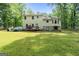 A spacious backyard with a wooden deck, perfect for outdoor entertaining and relaxation at 632 Cloudland Dr, Stockbridge, GA 30281