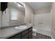 This bathroom has a shower and a dark vanity at 632 Cloudland Dr, Stockbridge, GA 30281