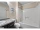 Standard bathroom with a combined shower and tub, with black cabinets and a toilet at 632 Cloudland Dr, Stockbridge, GA 30281