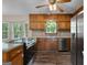 Kitchen with stainless appliances, wooden cabinets and hardwood floors at 632 Cloudland Dr, Stockbridge, GA 30281