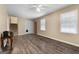 Large living room with light walls, ceiling fan, closet and light hardwood floors at 632 Cloudland Dr, Stockbridge, GA 30281