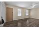 Living room with neutral walls, ceiling fan, and light hardwood floors offers a versatile living space at 632 Cloudland Dr, Stockbridge, GA 30281