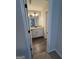 Bathroom featuring a granite vanity with white cabinets and a large mirror at 808 Covered Bridge Rd, Covington, GA 30016