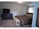 Comfortable bedroom includes a TV on dresser and neutral walls perfect for relaxation at 808 Covered Bridge Rd, Covington, GA 30016
