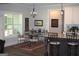 Eat-in kitchen with an adjacent dining area featuring iron chairs and a glass table at 808 Covered Bridge Rd, Covington, GA 30016