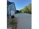 Wide paved driveway leads to the two-car garage of this two-story home at 808 Covered Bridge Rd, Covington, GA 30016