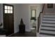 Home entryway leading to stairs and a powder room at 808 Covered Bridge Rd, Covington, GA 30016