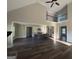 Spacious living room with hardwood floors that opens to the kitchen and a view of the second story loft at 808 Covered Bridge Rd, Covington, GA 30016