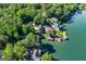 Stunning aerial view of lakefront homes, lush landscaping, and private boat docks at 1295 Heritage Dr, Villa Rica, GA 30180