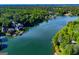 Beautiful aerial view of lakefront homes nestled among lush green trees at 1295 Heritage Dr, Villa Rica, GA 30180