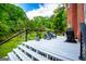 Inviting back porch with comfortable seating and grill, perfect for enjoying the outdoor scenery at 1295 Heritage Dr, Villa Rica, GA 30180